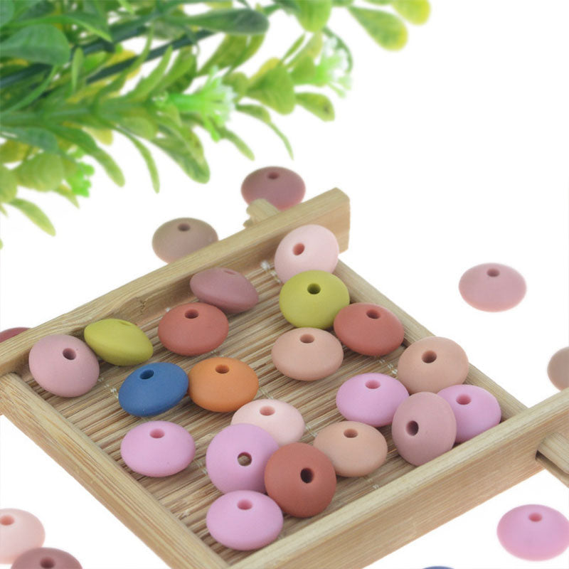 Venta al por mayor DIY 12mm Cuentas planas de silicona Color aleatorio 100pcs OLY-BDS-BX001